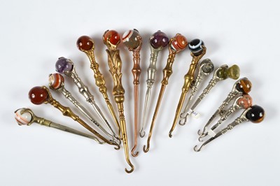 Lot 268 - A collection of novelty button or glove hooks