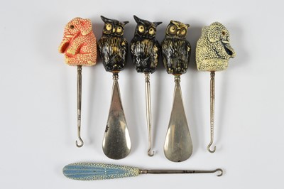 Lot 271 - A collection of novelty plastic button hooks and shoe horn