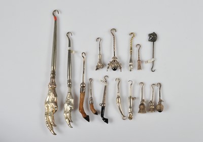 Lot 272 - A collection of novelty button or glove hooks