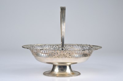 Lot 280 - A George V period silver swing handle dish by Goldsmiths & Silversmiths