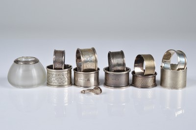 Lot 317 - Ten Victorian & later napkin rings, together with a napkin holder & silver rimmed glass match striker
