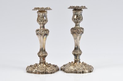 Lot 332 - A pair of late George III silver filled candlesticks