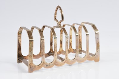 Lot 340 - A George VI silver toast rack by Viners