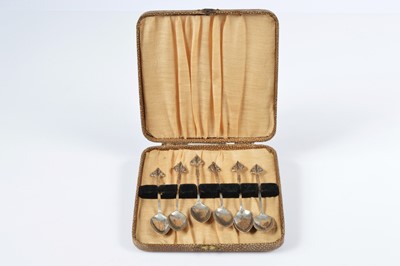 Lot 352 - A set of six Arts & Crafts period silver Cymric range coffee spoons designed by Archibald for Liberty & Co