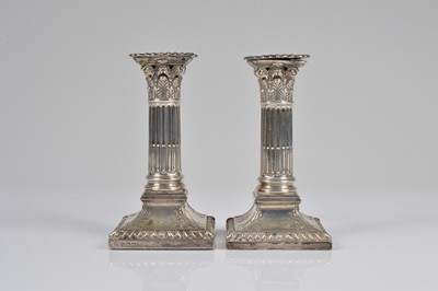 Lot 359 - A pair of Edwardian column silver filled candlesticks by H.E. Ltd