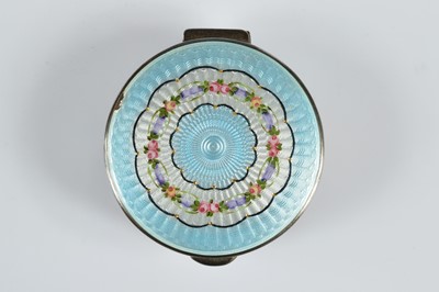 Lot 373 - A George V period silver and enamelled circular box