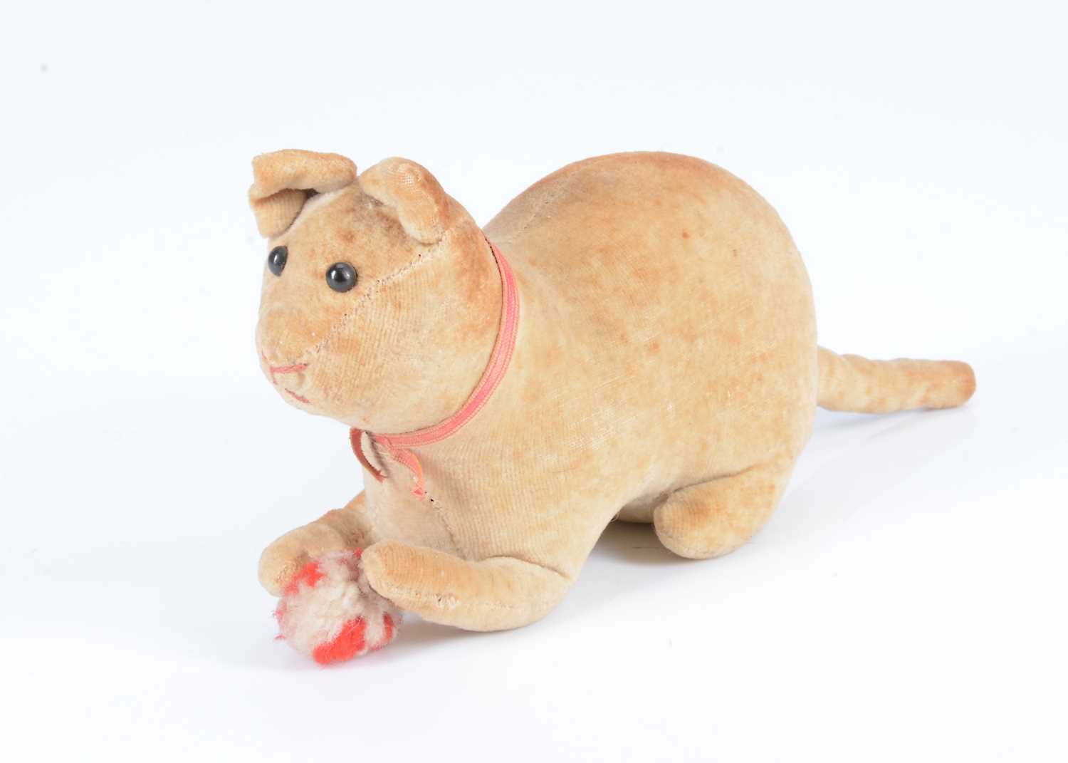 Lot 5 - An early lying velvet cat with pom-pom ball, circa 1908