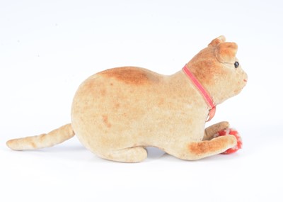 Lot 5 - An early lying velvet cat with pom-pom ball, circa 1908