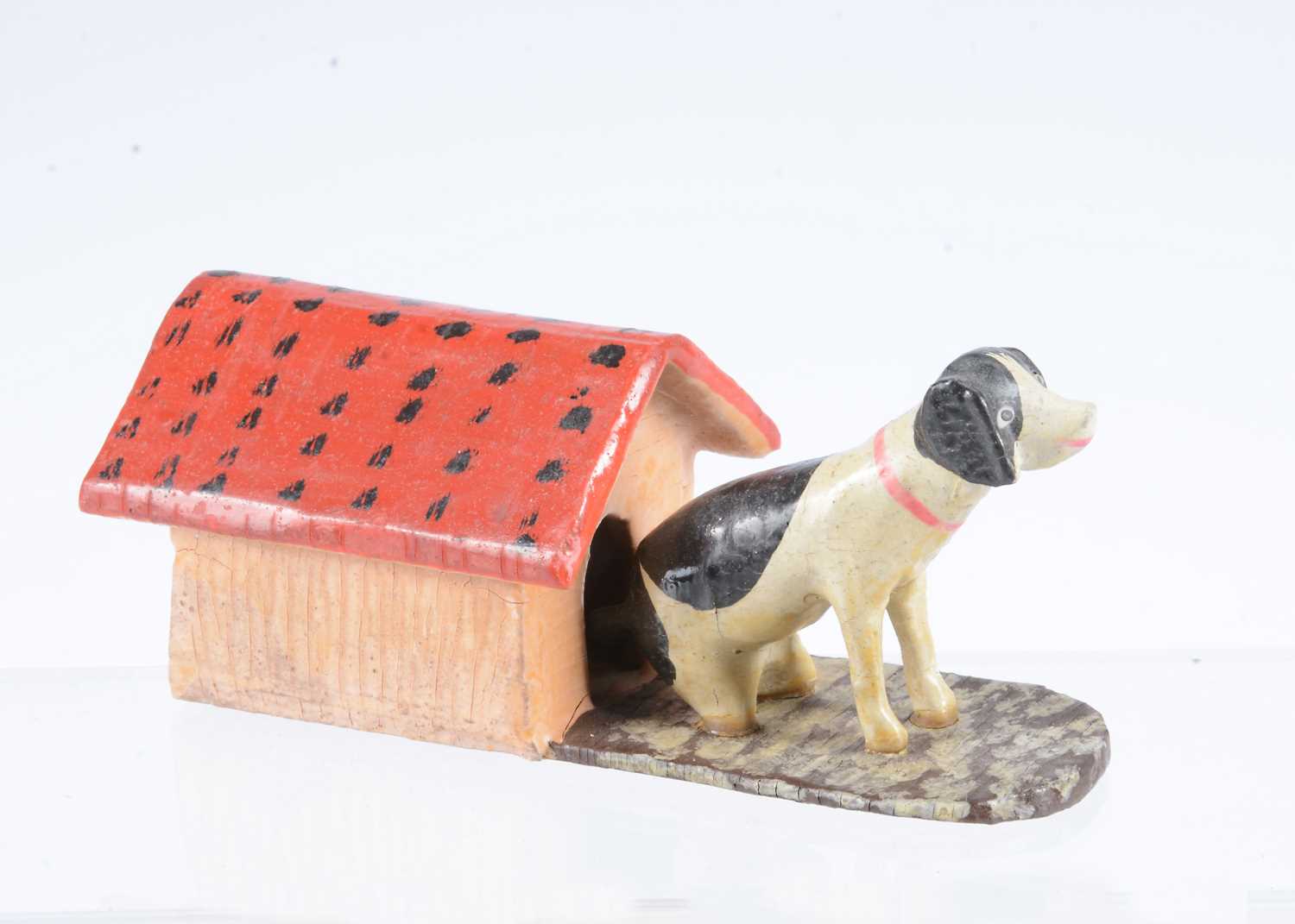 Lot 33 - A late 19th century Erzgebirge dog and kennel