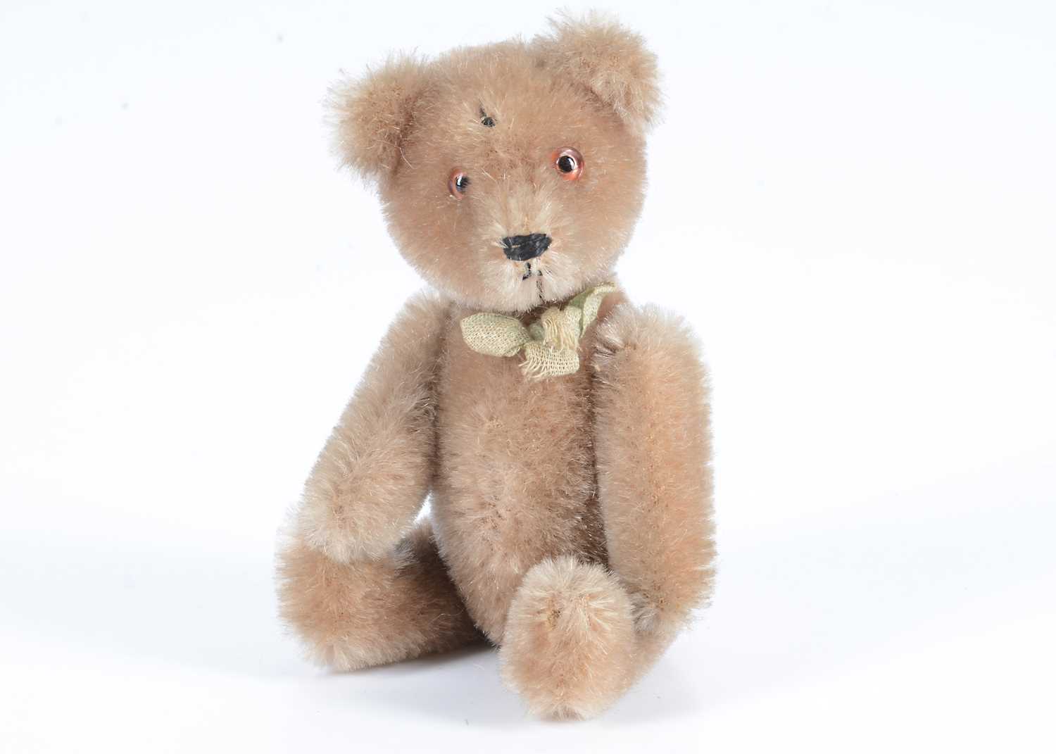 Lot 73 - A small post-war Schuco yes/no teddy bear