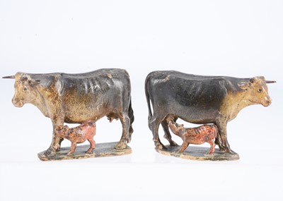 Lot 302 - A pair of 19th century Oberammergau carved wooden cows with suckling calves