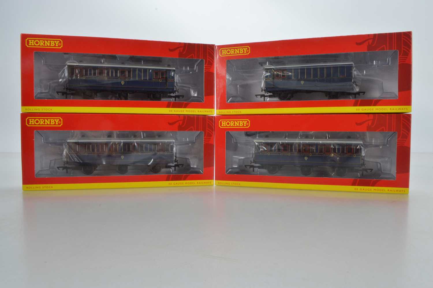 Lot 93 - Hornby (China) boxed 00 Gauge S&DJR Somerset and Dorset Joint Railway lined blue 6 wheel Coaches and 4-wheel Brake Luggage Van (4)