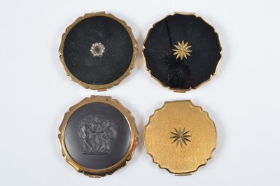 Lot 673 - Three 1950s gilt metal and black Princess Stratton compacts