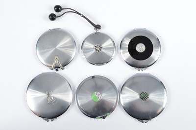Lot 681 - Six circular chromed mid 1930s continental compacts