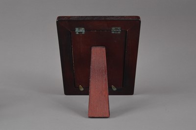 Lot 177 - A modern Arts and Crafts style silver and enamelled photograph frame