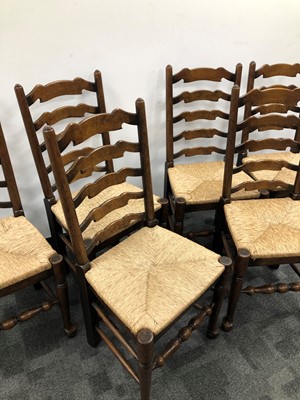 Lot 23 - A set of six early 20th century ladder back chairs
