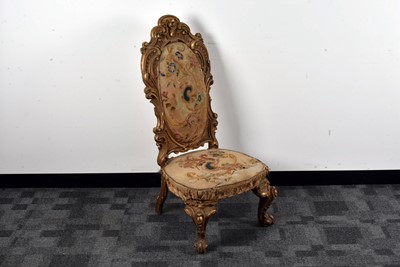 Lot 31 - A pair of French gilt upholstered armchairs