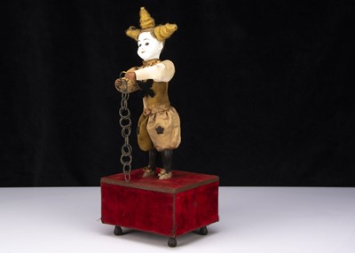 Lot 272 - A late 19th century French white faced clown automaton with magic ring trick