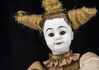 Lot 272 - A late 19th century French white faced clown automaton with magic ring trick