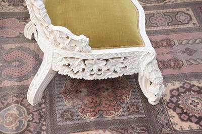 Lot 93 - A later painted Victorian period Anglo-Indian carved hardwood high back chair
