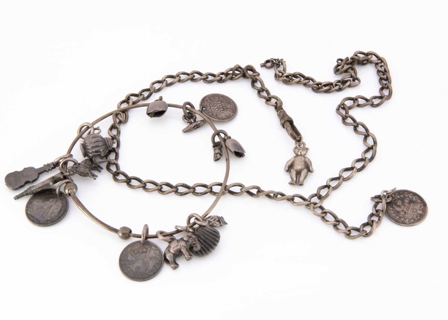 Lot 15 - An Edwardian white metal bangle