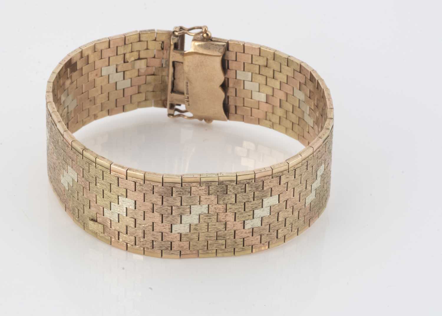 Lot 64 - A 9ct three colour gold bracelet