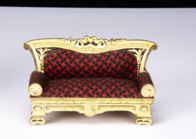 Lot 56 - A rare German chromolithograph paper on wood dolls’ house ivory and ebony saloon set