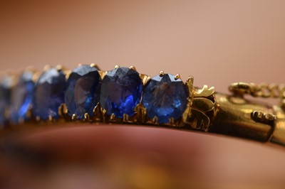 Lot 15 - A nice gold and sapphire bangle