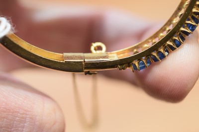 Lot 15 - A nice gold and sapphire bangle