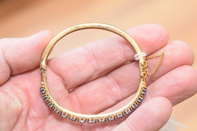 Lot 15 - A nice gold and sapphire bangle