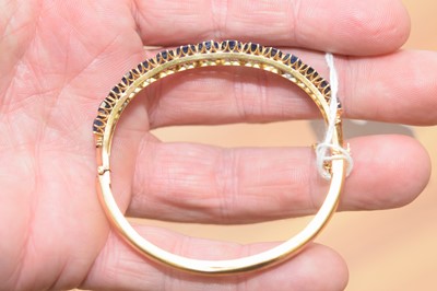 Lot 15 - A nice gold and sapphire bangle