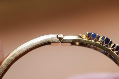Lot 15 - A nice gold and sapphire bangle