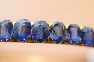 Lot 15 - A nice gold and sapphire bangle