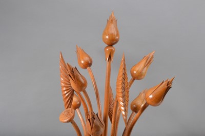 Lot 127 - A carved hardwood sculpture of flowers