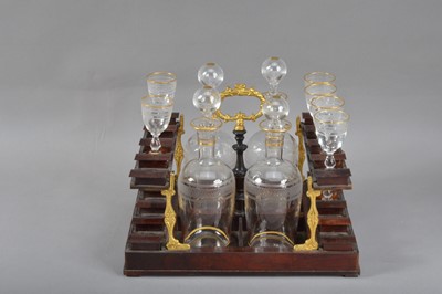 Lot 131 - A regency burr walnut veneered ebonised and boxwood inlaid decanter box