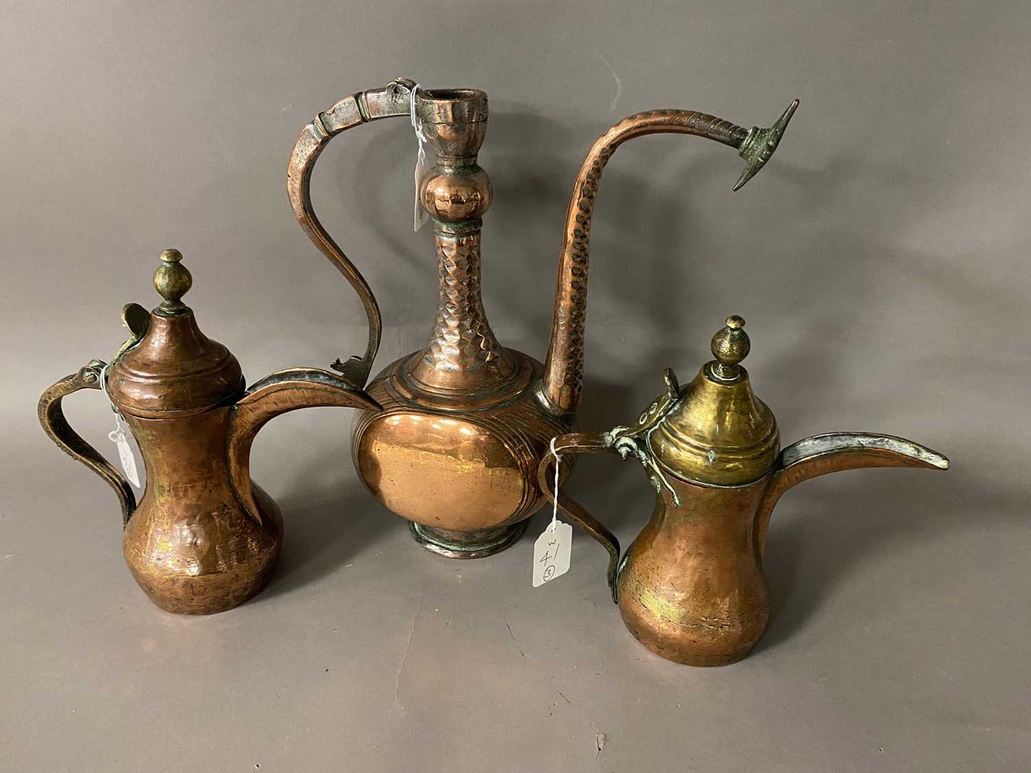 Lot 133 - Two vintage Middle Eastern copper coffee pots and a water pot