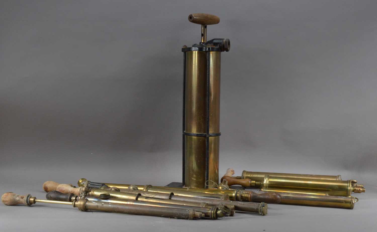 Lot 189 - A collection of antique brass hand pumps