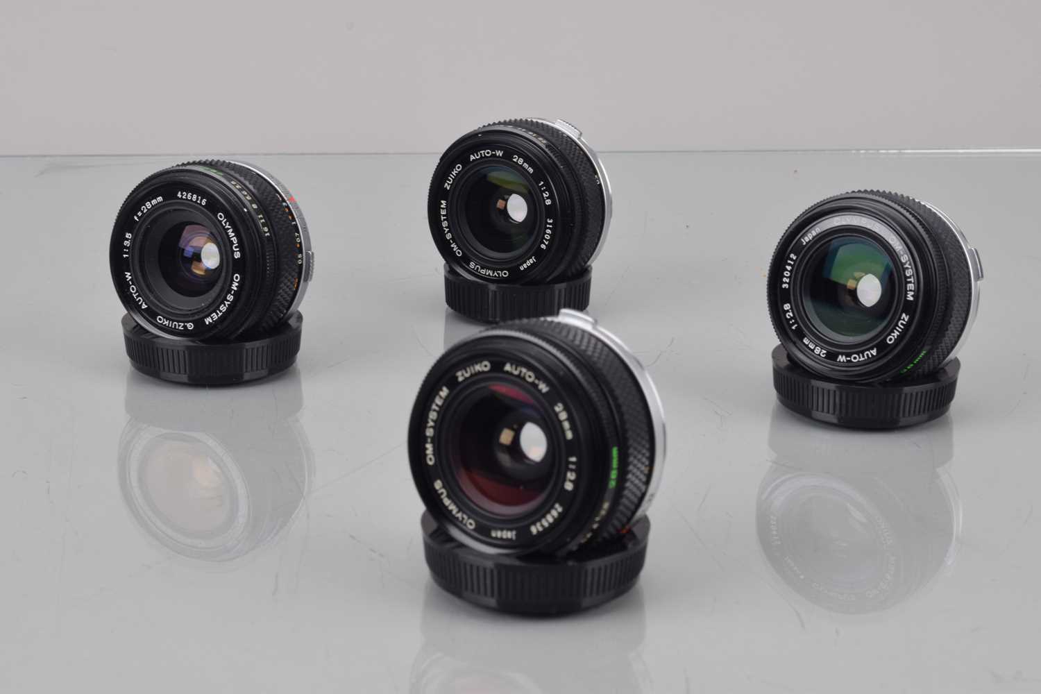 Lot 42 - Four Olympus OM Wide Angle Lenes