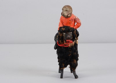 Lot 3 - A late 19th century German composition monkey riding a poodle candy container