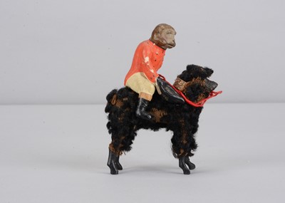 Lot 3 - A late 19th century German composition monkey riding a poodle candy container