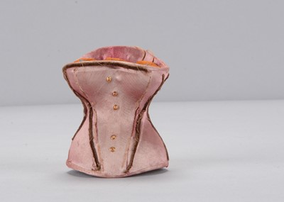 Lot 21 - A late 19th century novelty gentleman popping up from a pink silk corset