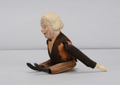 Lot 46 - An early 20th century German composition headed David Lloyd George clockwork tumbling toy