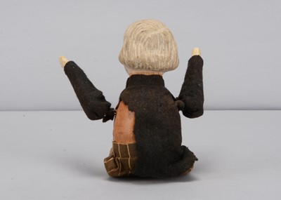 Lot 46 - An early 20th century German composition headed David Lloyd George clockwork tumbling toy