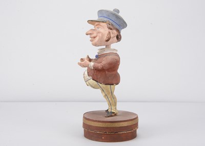 Lot 51 - A late 19th century Thüringen Mr Punch type character nodder candy/sweet container