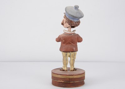 Lot 51 - A late 19th century Thüringen Mr Punch type character nodder candy/sweet container
