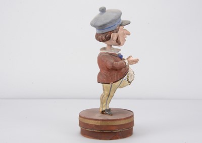 Lot 51 - A late 19th century Thüringen Mr Punch type character nodder candy/sweet container