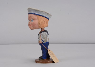 Lot 52 - An early 20th century Thüringen composition comic boy nodder