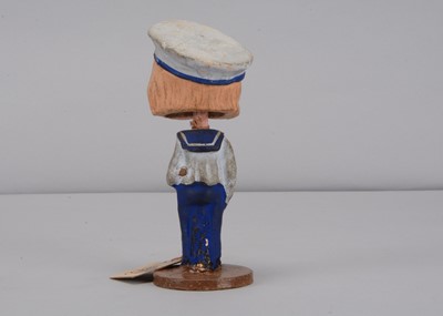 Lot 52 - An early 20th century Thüringen composition comic boy nodder