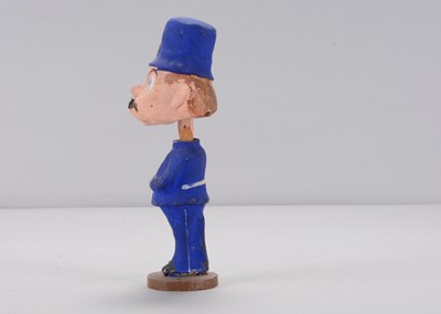 Lot 55 - An early 20th century Thüringen Palmer Cox Brownie policeman nodder