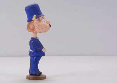 Lot 55 - An early 20th century Thüringen Palmer Cox Brownie policeman nodder